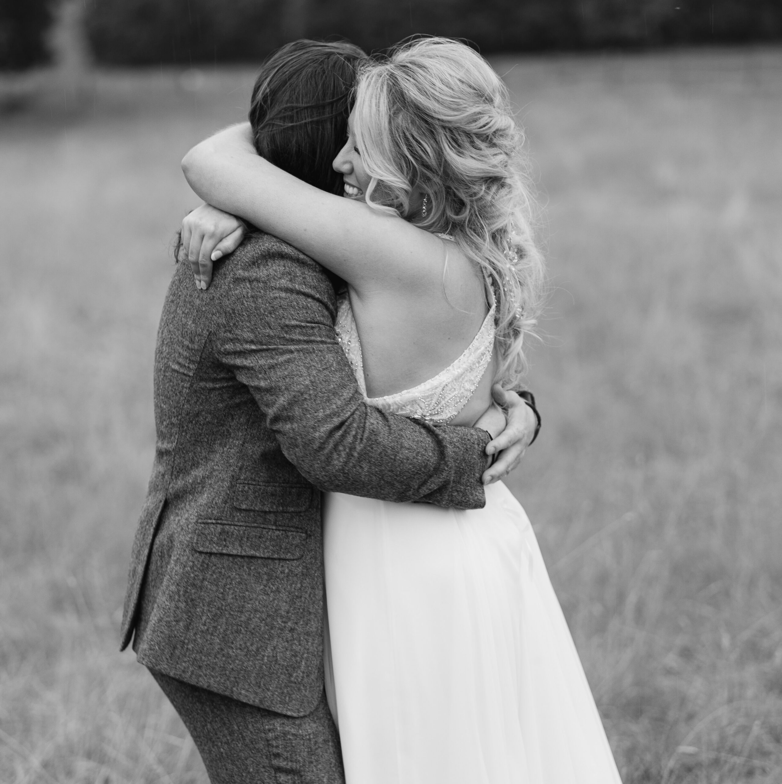Black and white wedding portrait of a couple embracing at Gaynes Park in Essex captured by Chi Ramos Studio